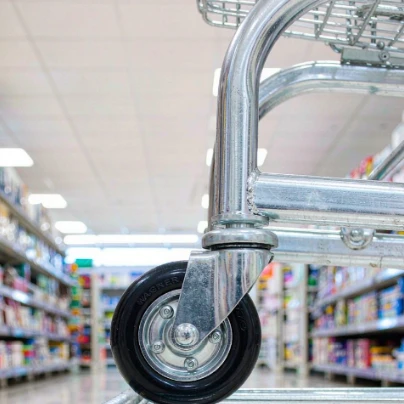 Shopping cart casters on a supermarket trolley in a retail store